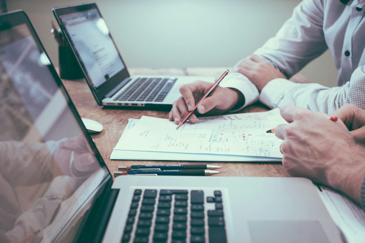 Planning documents on a desk — website budgets start with scope, not a page count