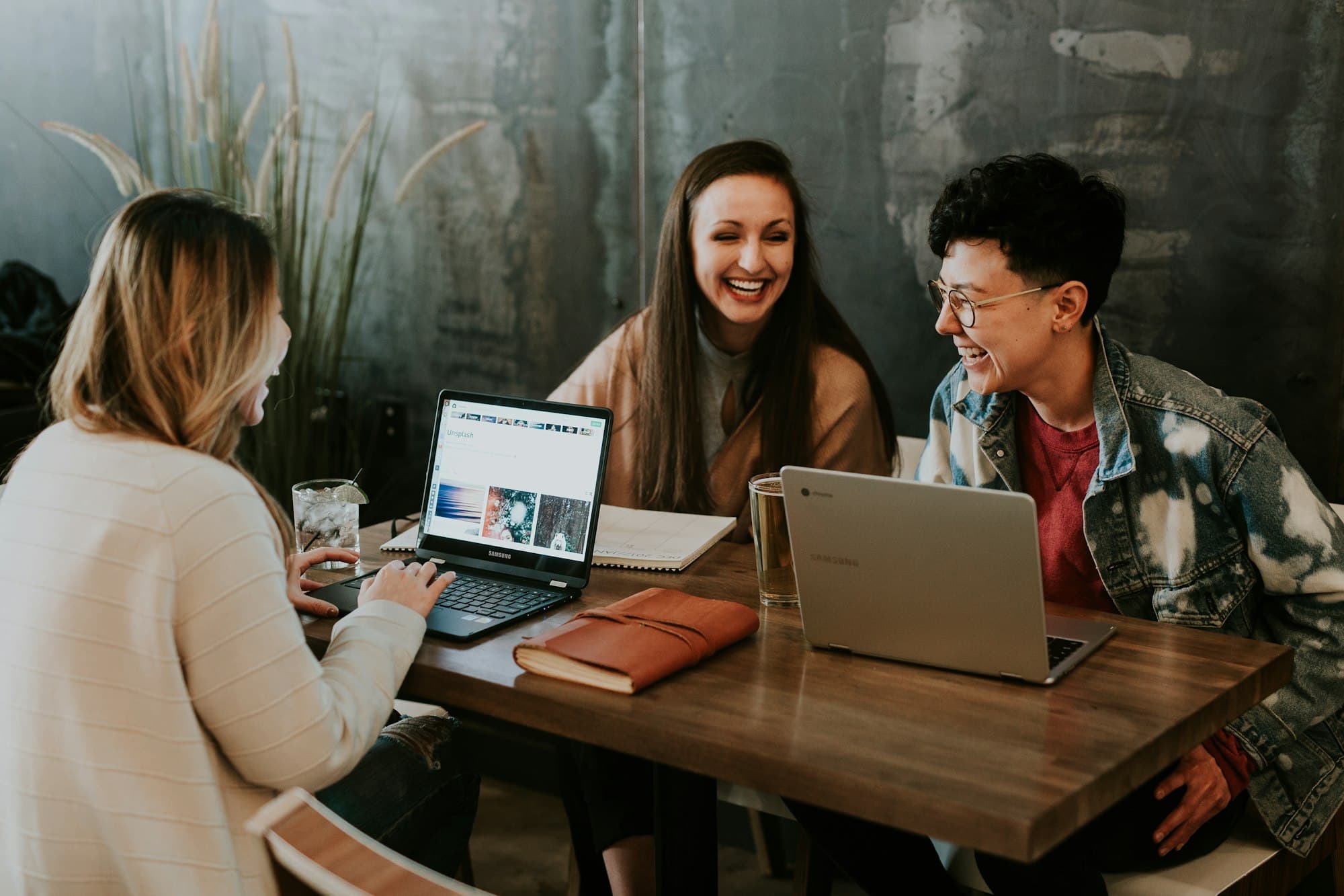 People around laptops — the conversation is happening where they already are, not on an unannounced URL
