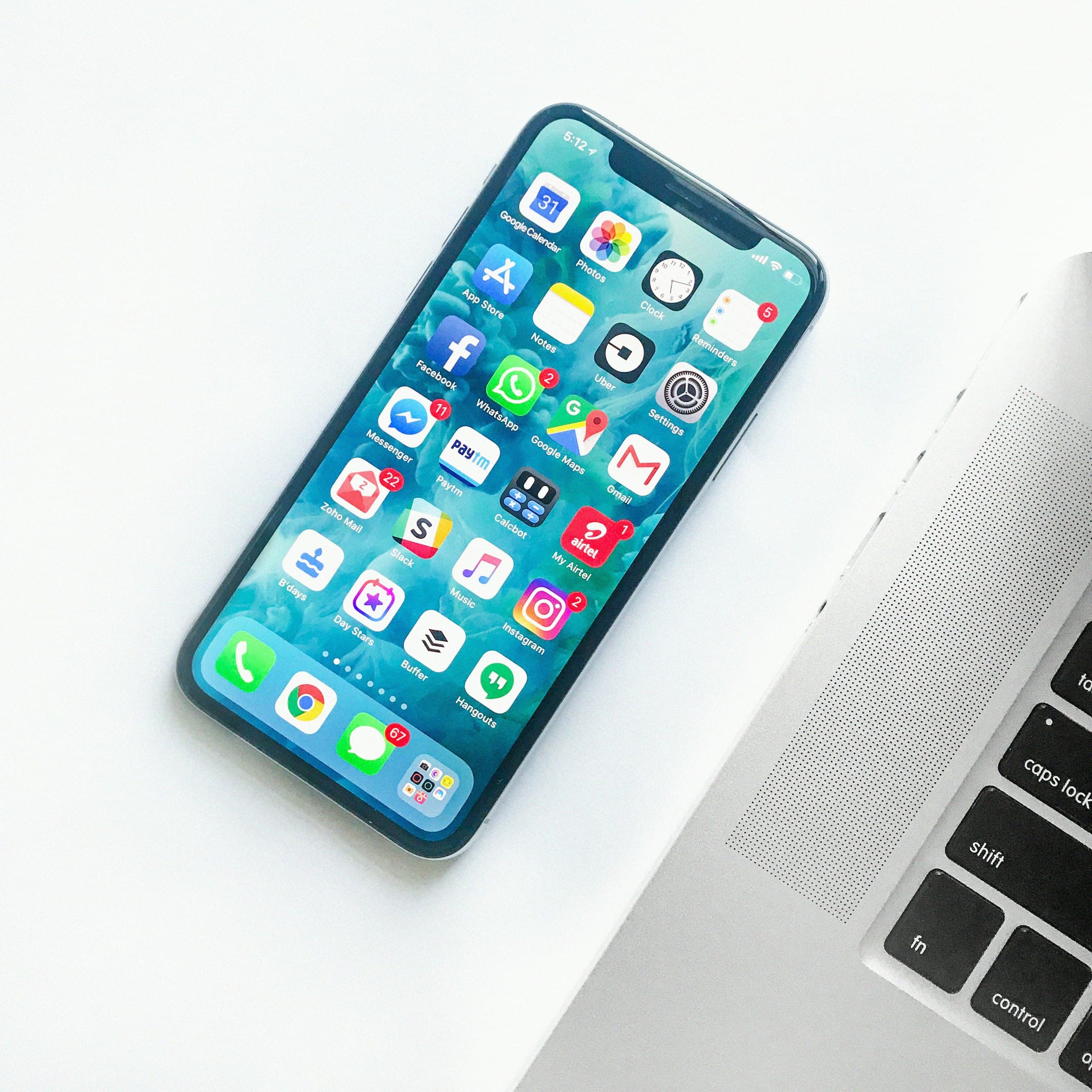 A phone next to a laptop — sharing a React codebase is a real constraint, not a slogan