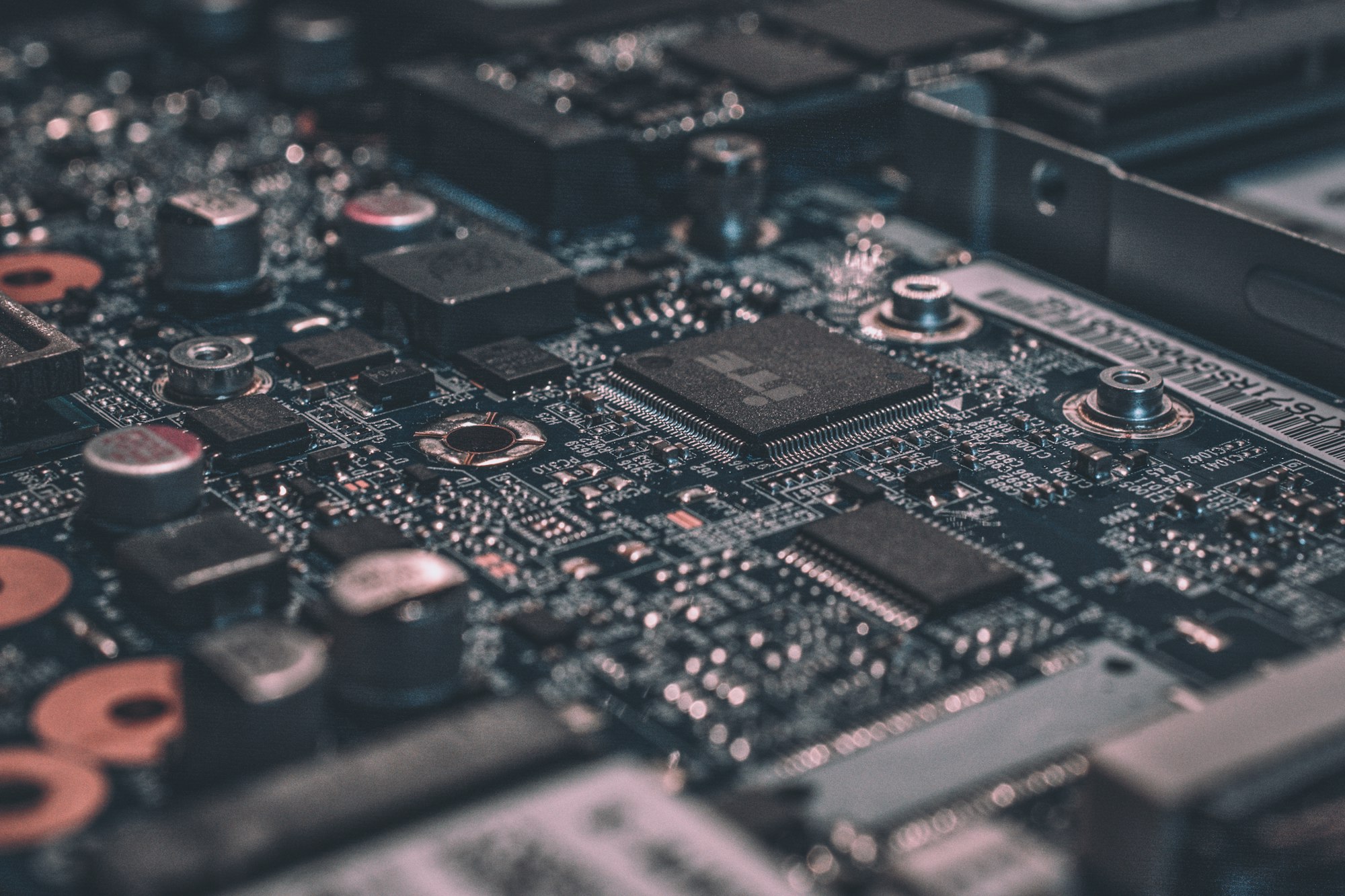 Close-up of a circuit board — machine-speed paths, not page loads
